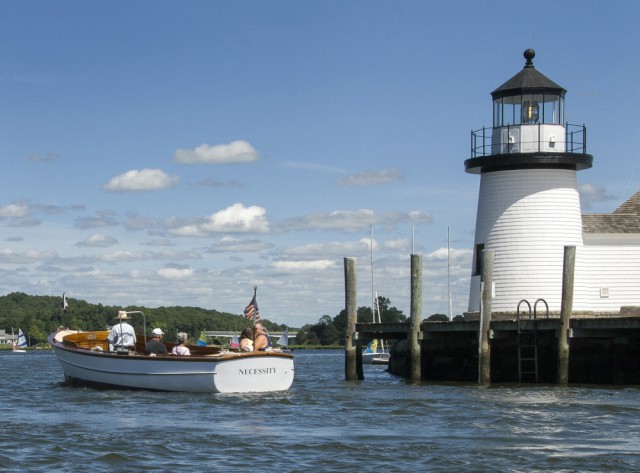 NECESSITY cruises past Lighthouse Point at Mystic Seaport.